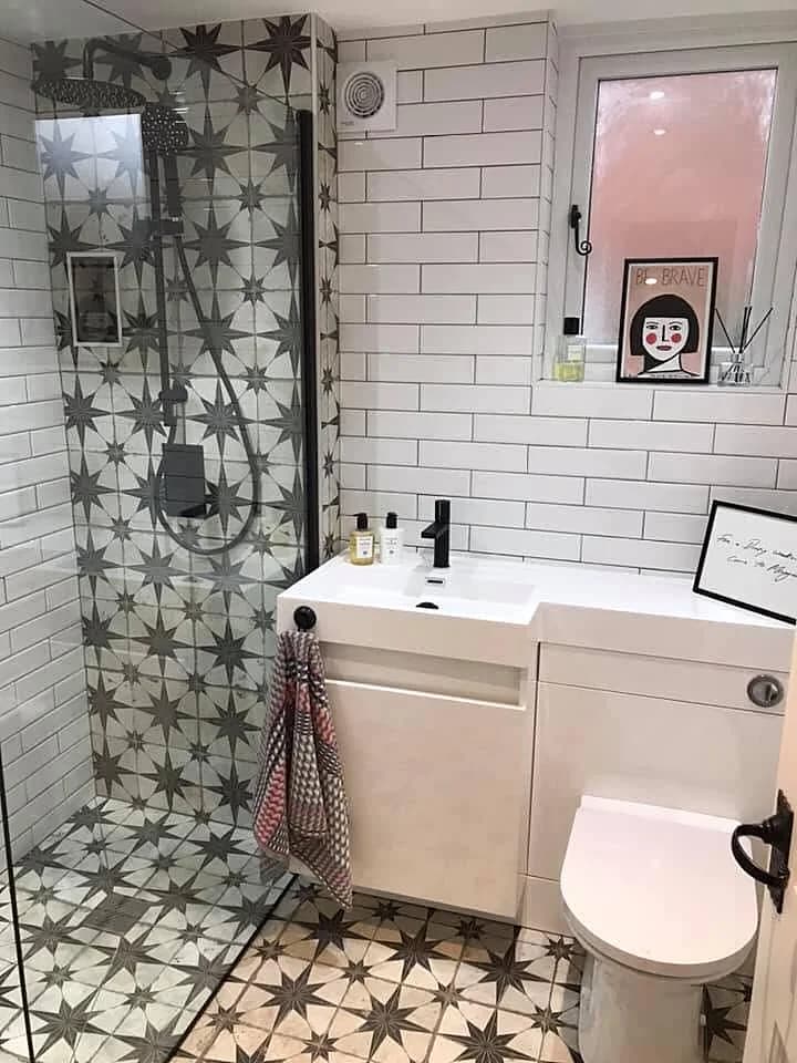 White metro-tiled bathroom with walk-in shower and patterned encaustic floor, completed in Leeds by CLM Projects