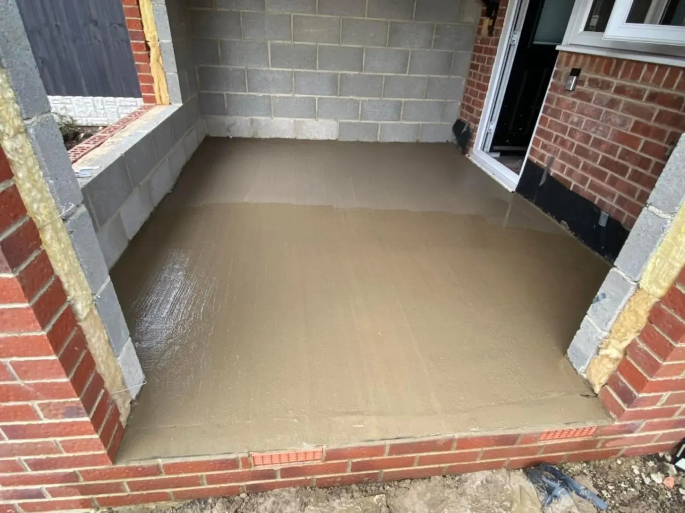 Concrete floor screed laid inside a new extension