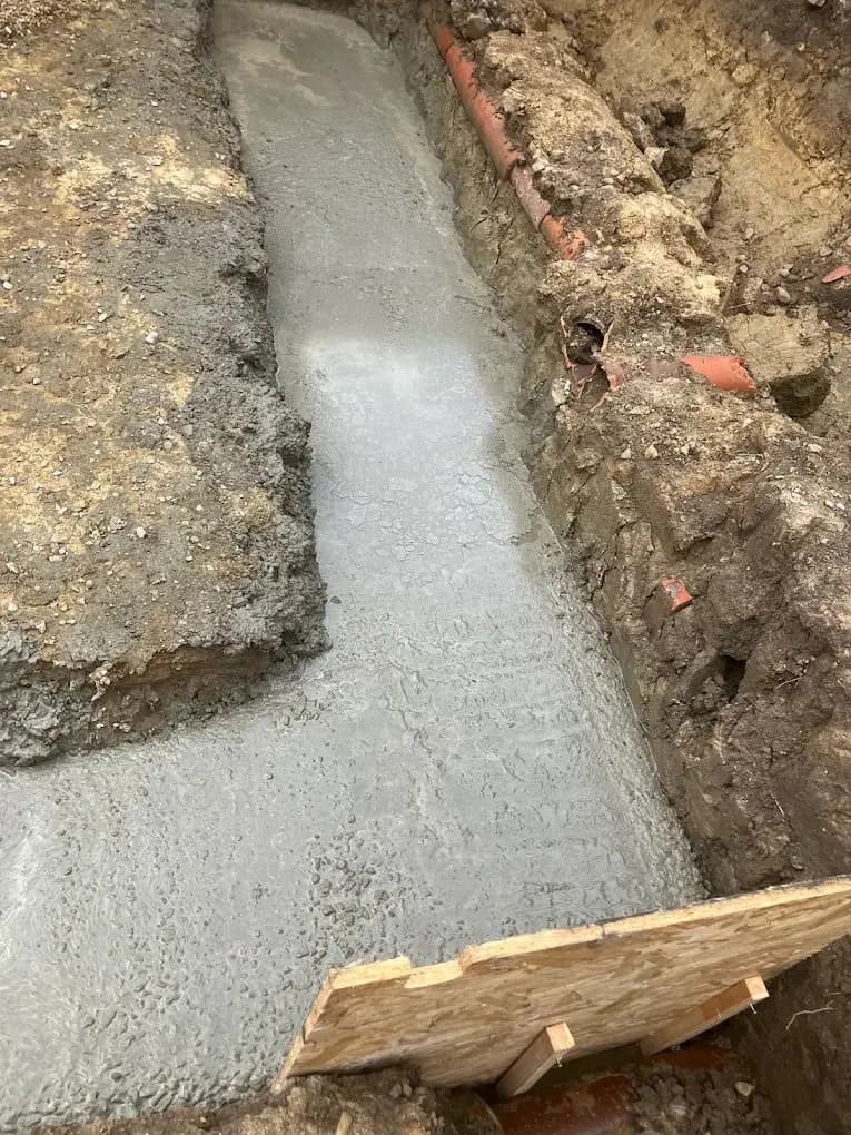 Concrete strip footing poured in a foundation trench