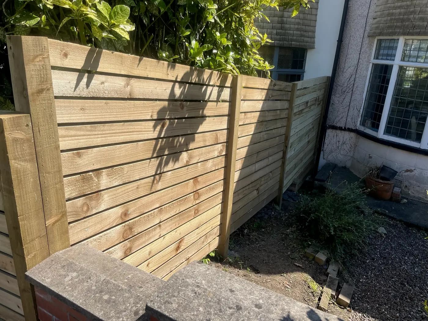 Timber fencing with brick pillar coping in a Leeds back garden, completed by CLM Projects