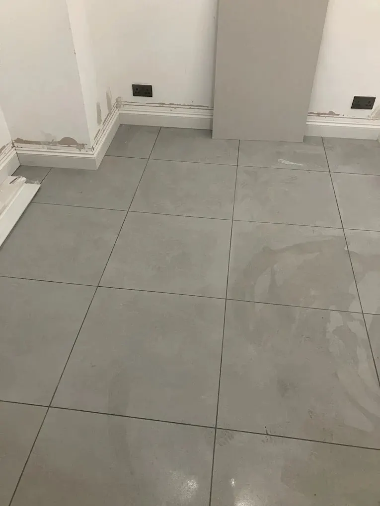 Large format floor tiles laid in a utility room