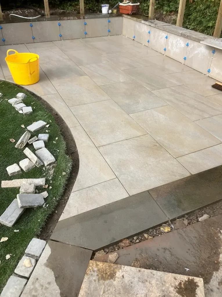 Large porcelain patio nearing completion