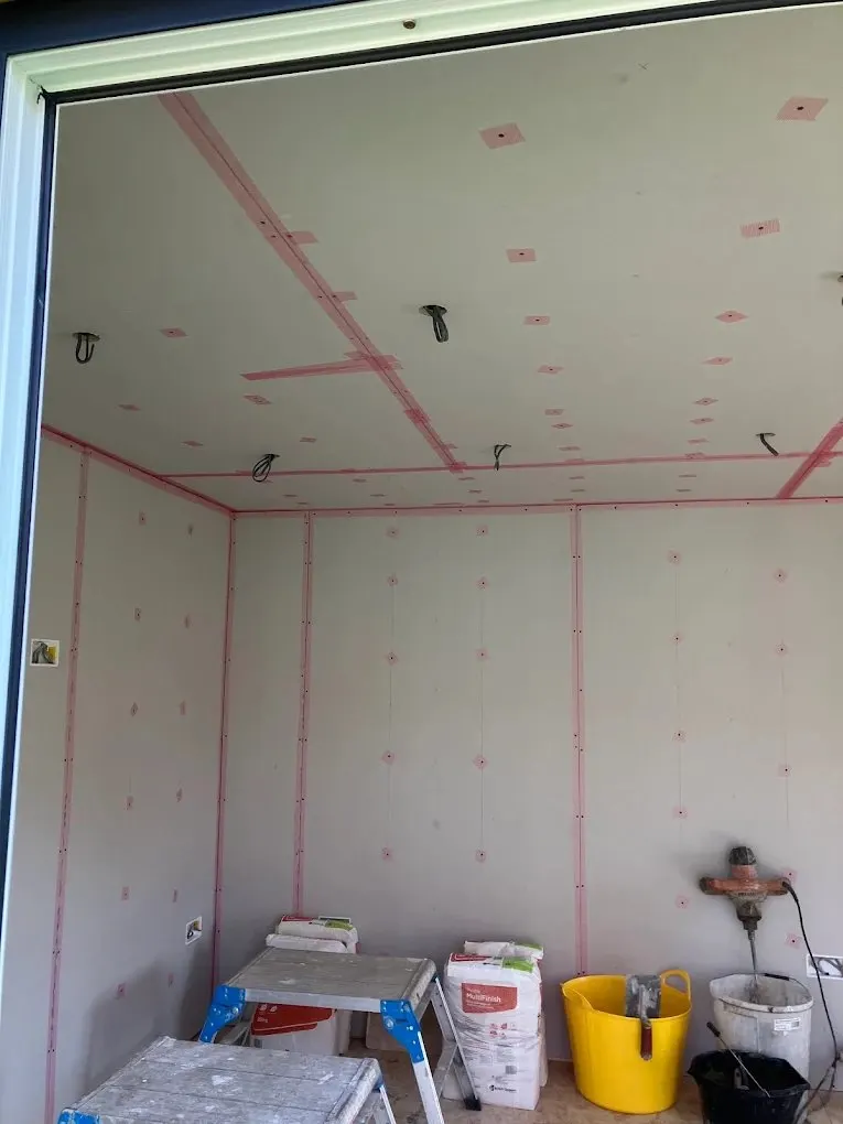 Plasterboarded room ready for a skim finish
