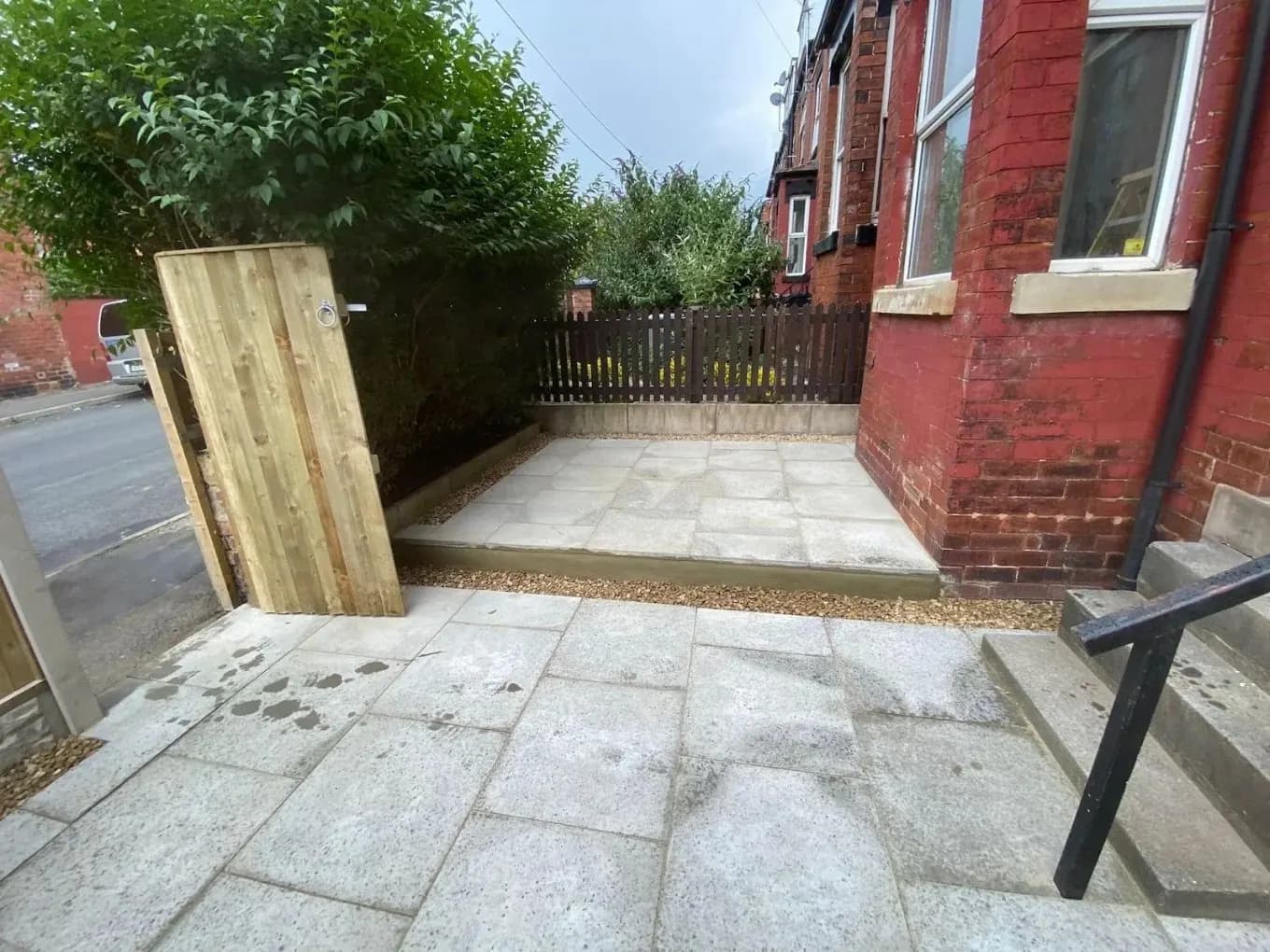 Rear courtyard paving with timber gate and fencing