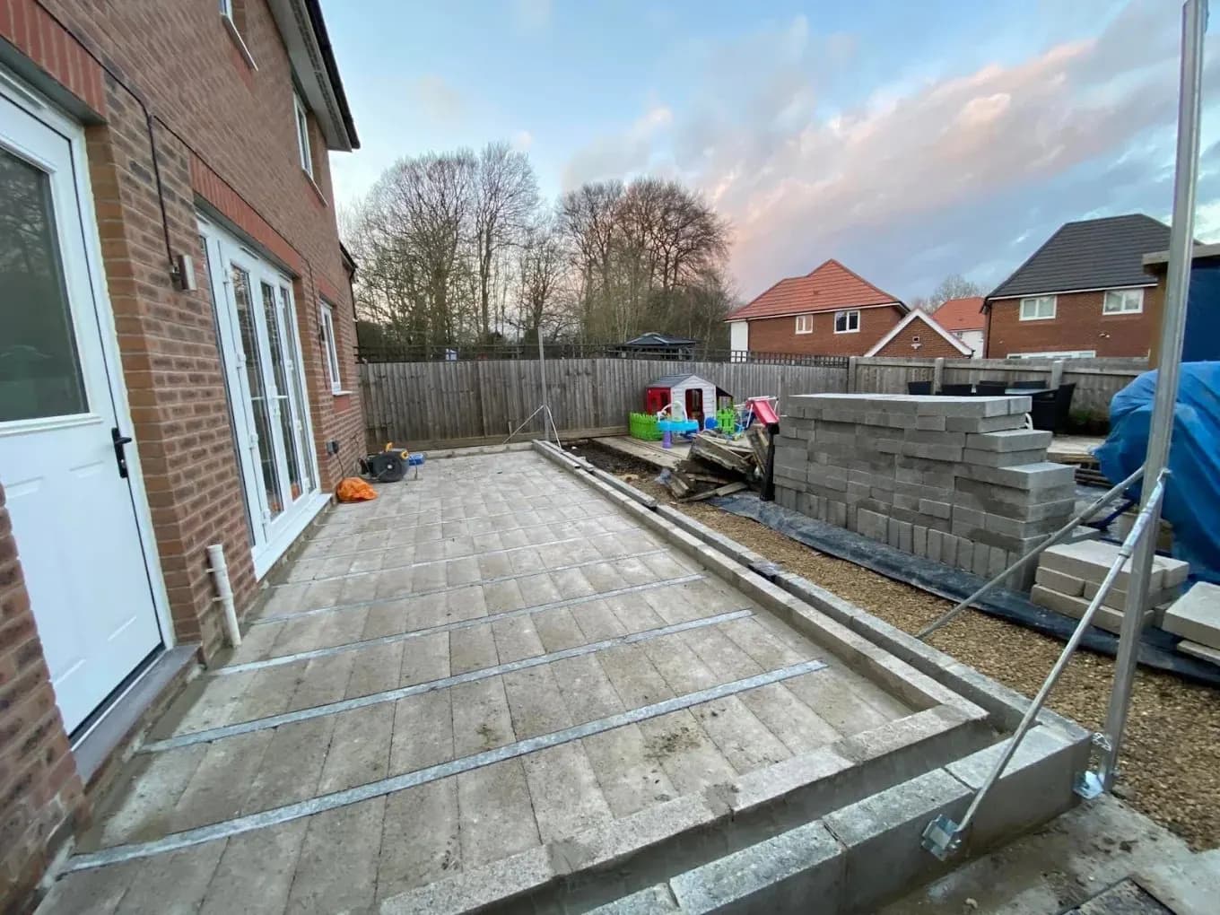 Rear garden patio paving with materials stacked ready