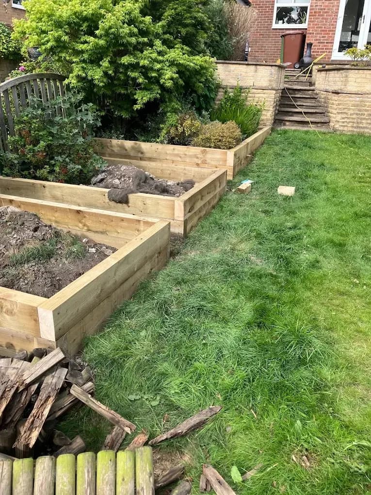 Timber raised garden beds installed in a lawn