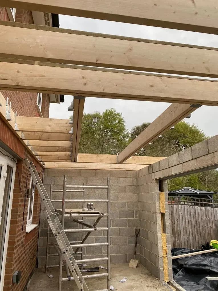 Timber roof joists installed over extension blockwork