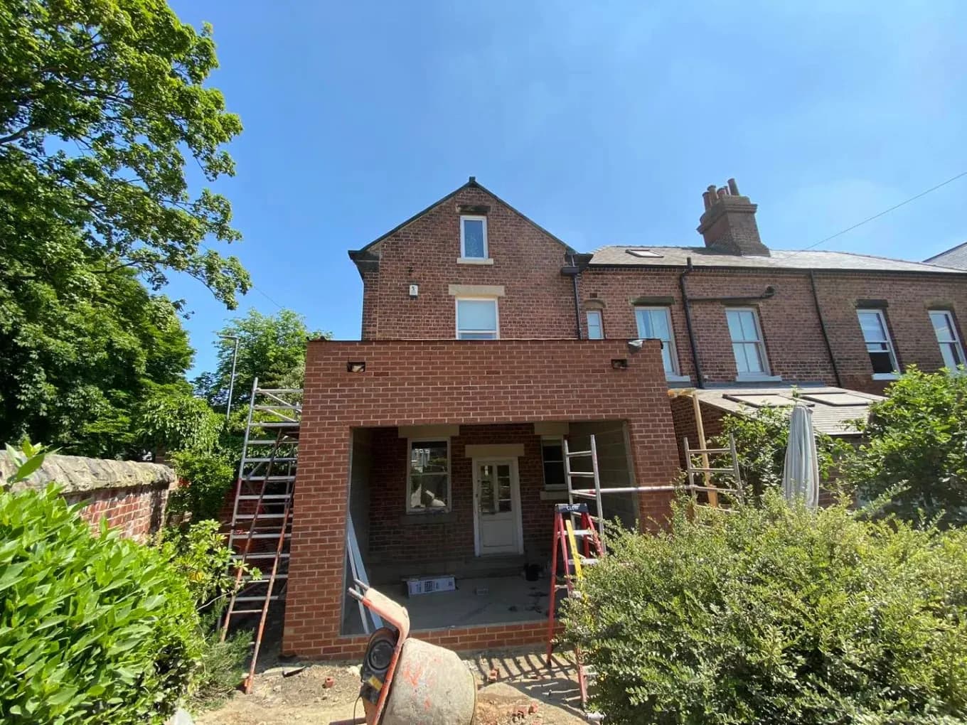 Two-storey brick extension under construction