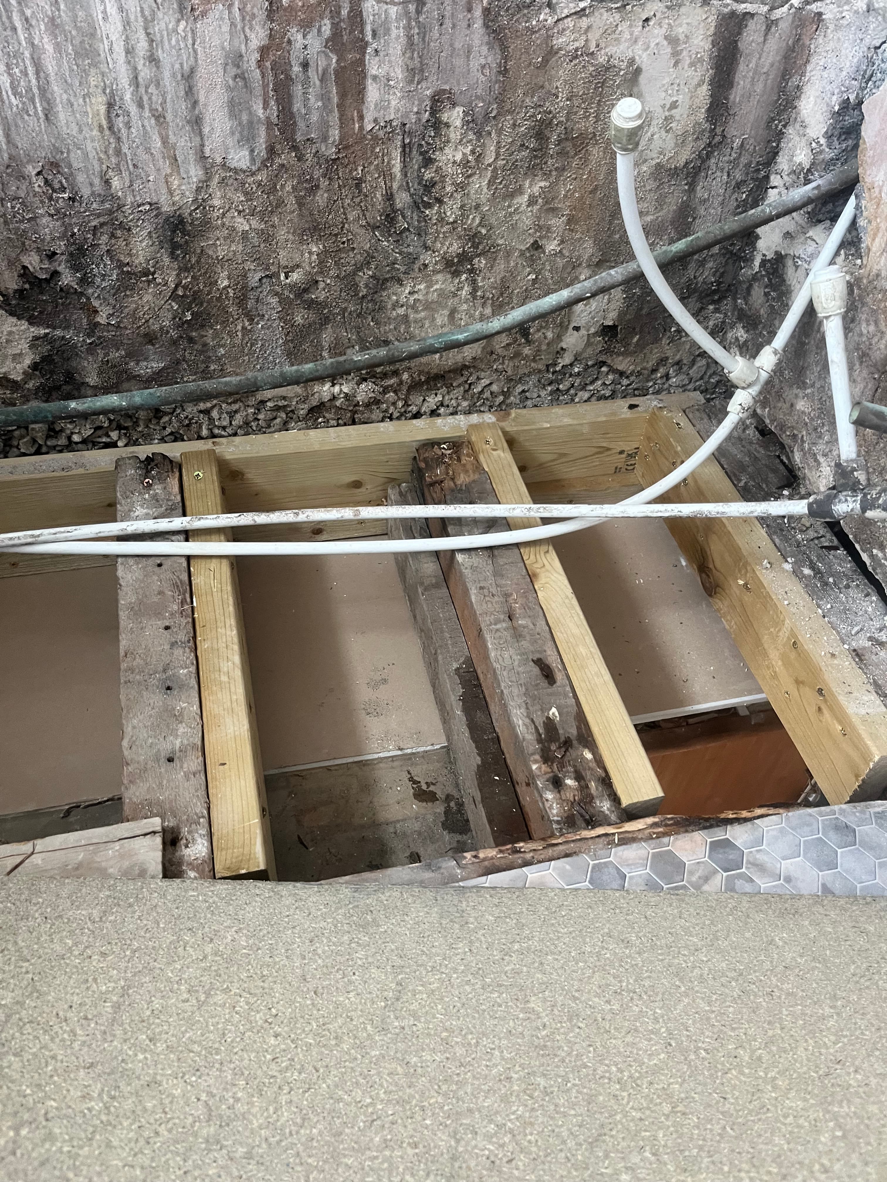 Timber floor repair exposed during the bathroom reinstatement