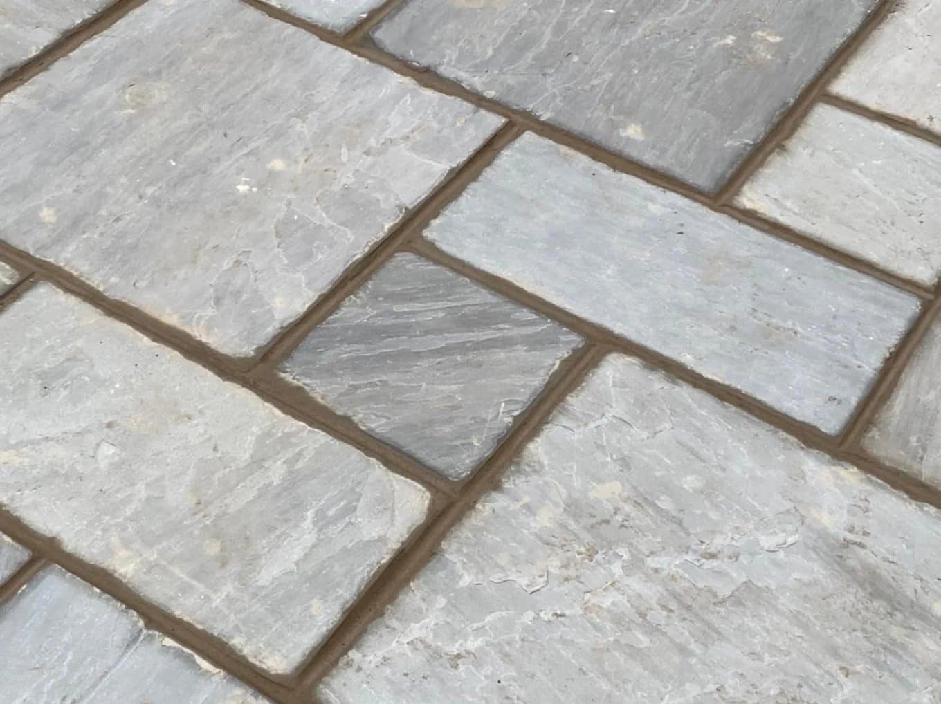 Riven natural stone paving laid in a staggered pattern with neat brushed-in pointing, completed in Leeds by CLM Projects
